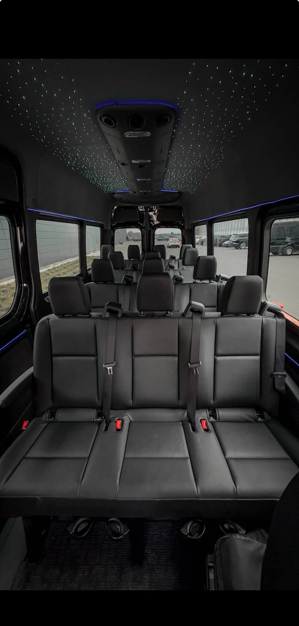 Executive Sprinter cabin with rows of leather seats