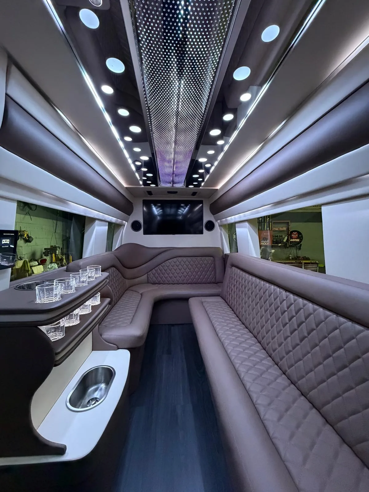 Luxury Sprinter lounge with quilted perimeter seating