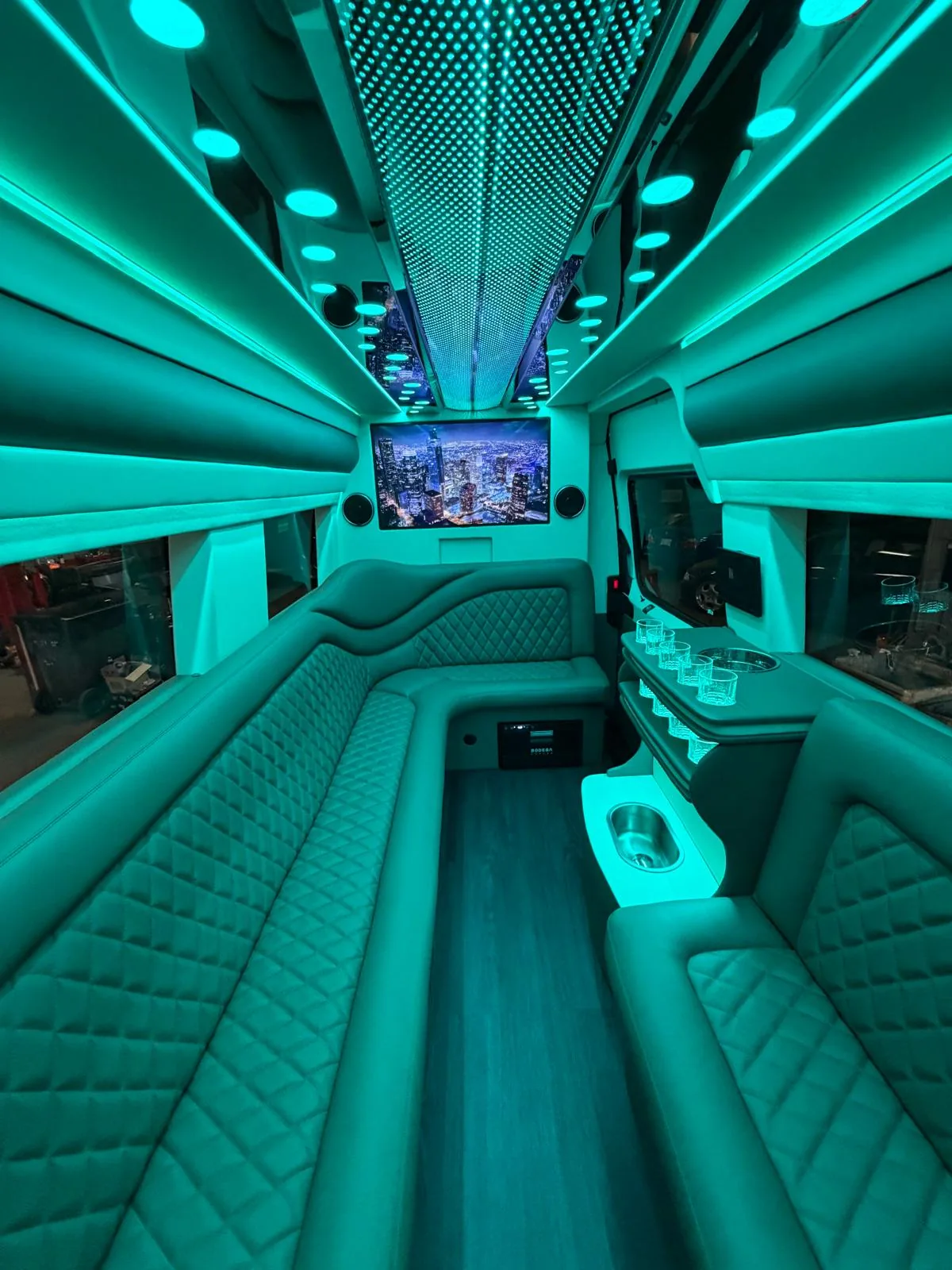 Luxury Sprinter lounge lit in teal